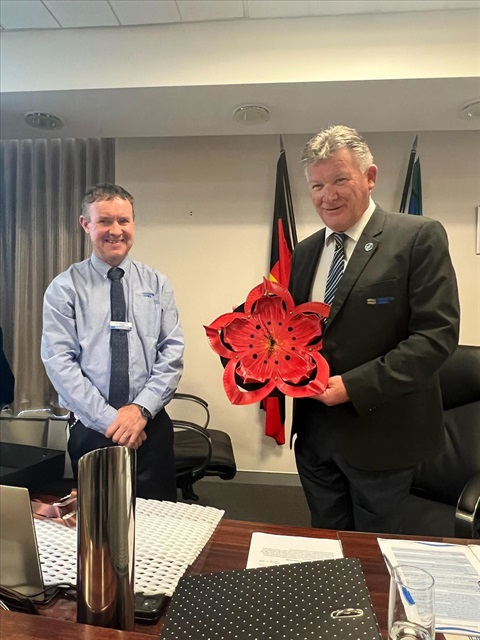 Adrian Butler and Patrick Bourke with Dwarf Azalea Flower